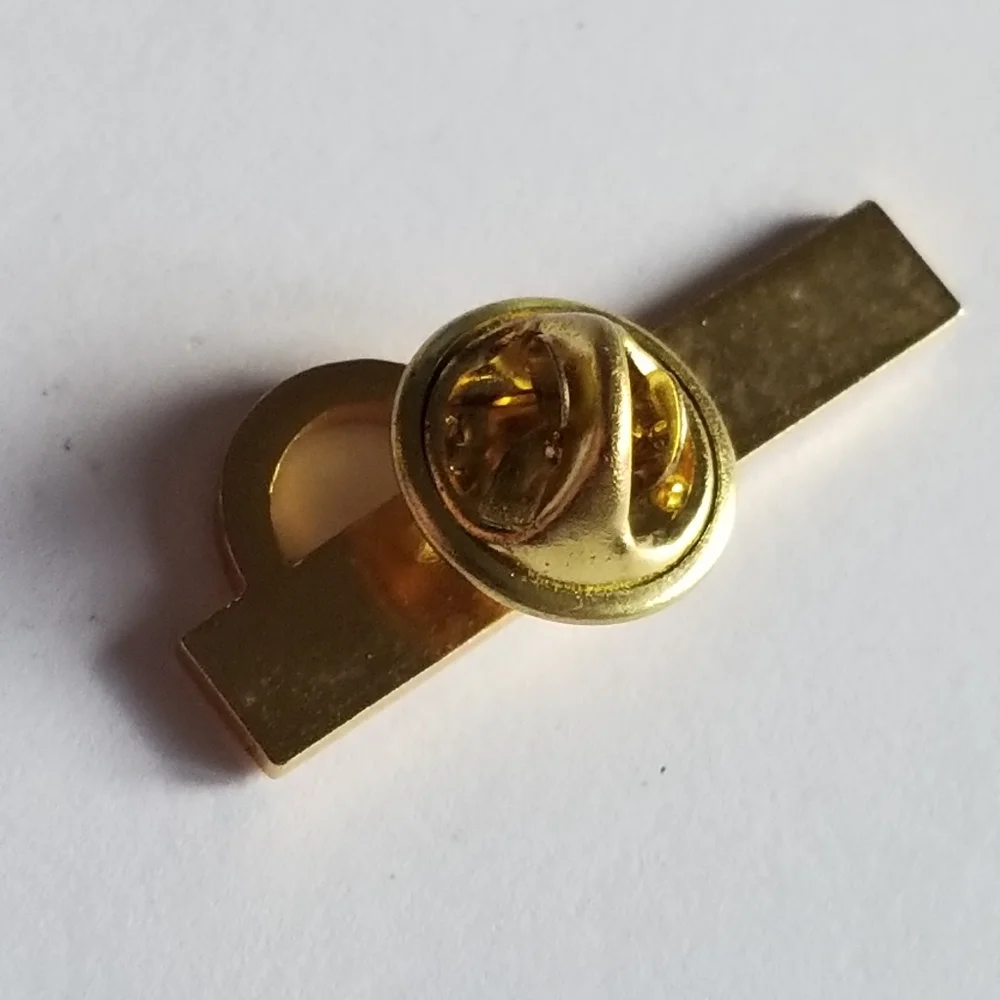 Mentor lapel pin Omega red enamel gold tone metal Greek symbol brooch